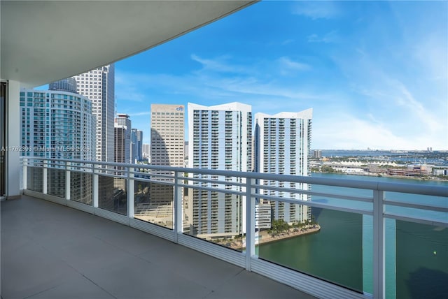 balcony with a view of city and a water view