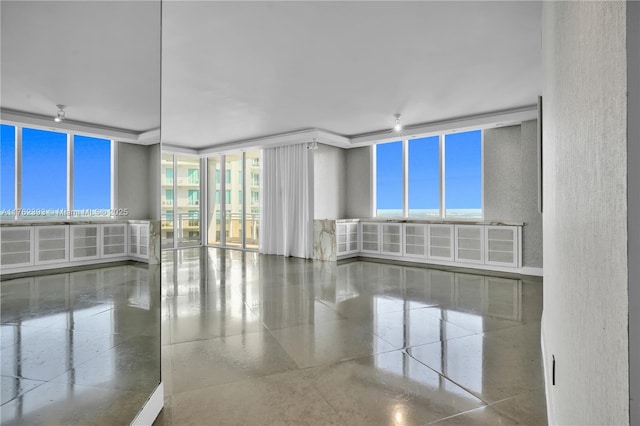 unfurnished room featuring granite finish floor