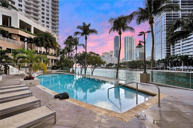 view of swimming pool with a city view