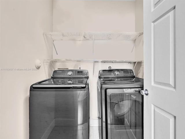 clothes washing area featuring washing machine and clothes dryer