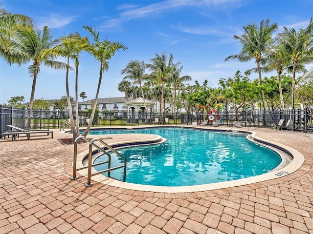 3525 NW 14th Ct, Lauderhill, FL 33311 - community pool featuring a patio area and fence