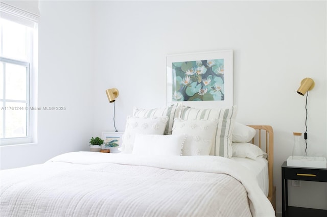 bedroom featuring multiple windows