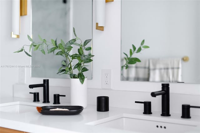 interior details featuring a sink and double vanity