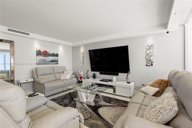 living area featuring visible vents and recessed lighting