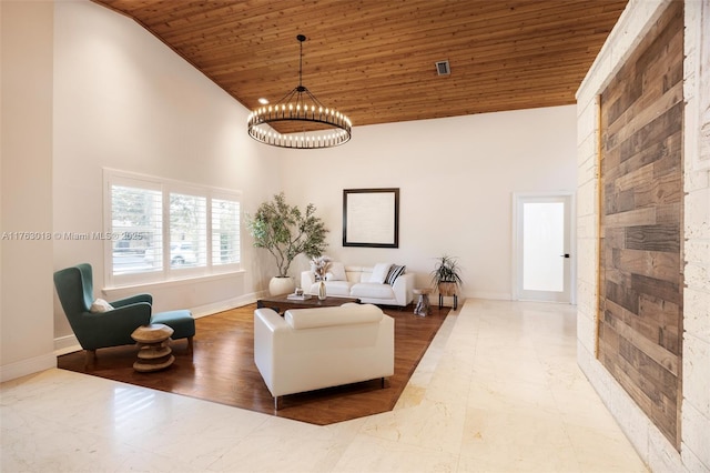 living room featuring visible vents, high vaulted ceiling, an inviting chandelier, wooden ceiling, and baseboards