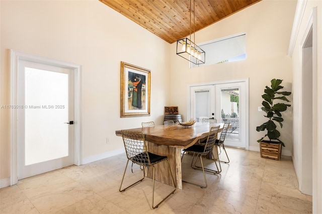 dining room featuring baseboards, french doors, wooden ceiling, marble finish floor, and a chandelier