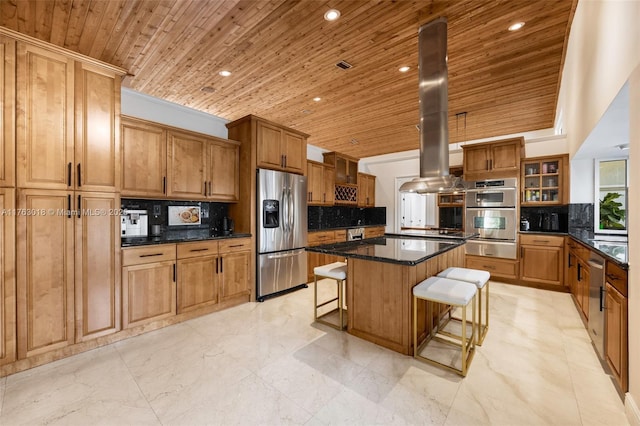 kitchen featuring wooden ceiling, island range hood, a breakfast bar area, and stainless steel appliances