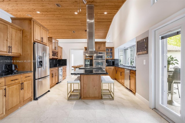 kitchen featuring a kitchen island, a breakfast bar area, wooden ceiling, stainless steel appliances, and a sink