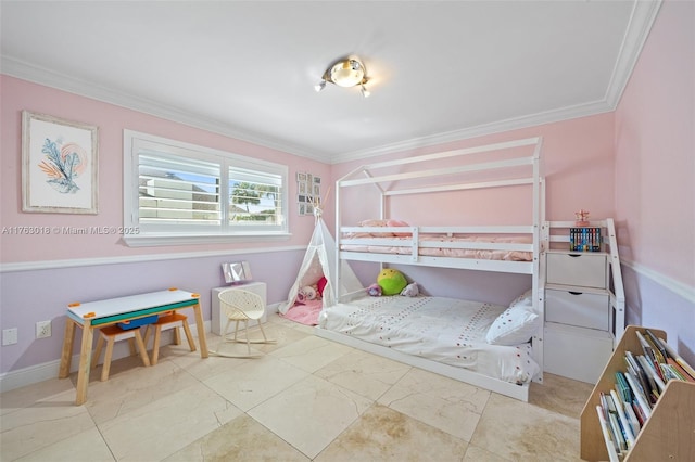 bedroom featuring baseboards and ornamental molding