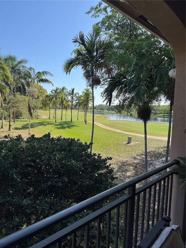 exterior space featuring a water view and a lawn