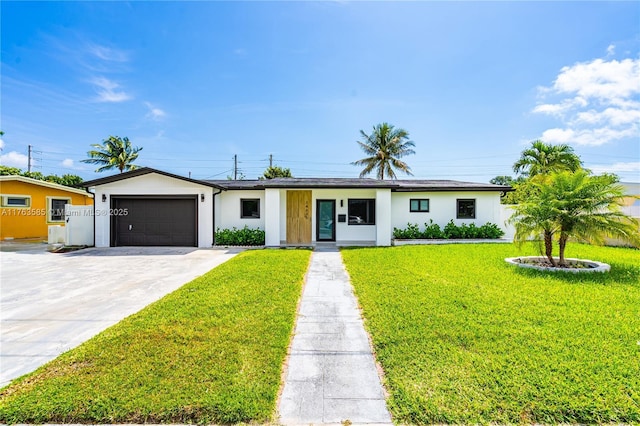 ranch-style house featuring stucco siding, a front yard, concrete driveway, and an attached garage