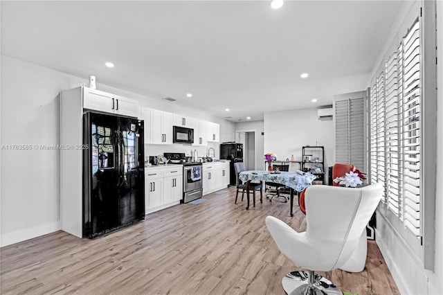 dining space featuring recessed lighting, light wood-style floors, and a healthy amount of sunlight