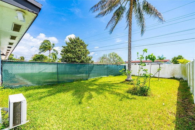 view of yard with a fenced backyard