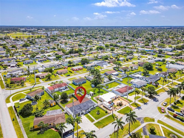 birds eye view of property with a residential view