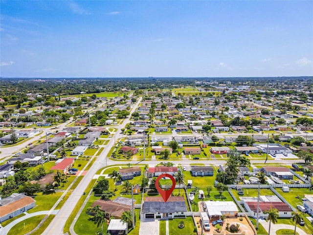 birds eye view of property with a residential view