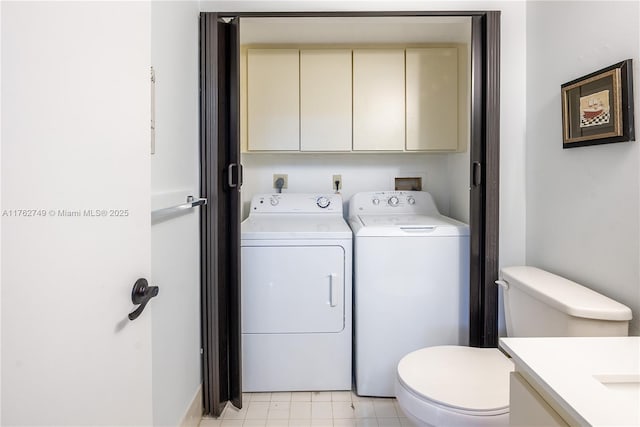 laundry room with cabinet space and washing machine and clothes dryer