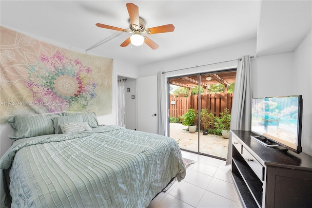 bedroom featuring access to exterior, light tile patterned floors, and ceiling fan