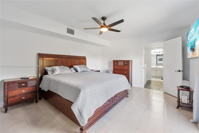 bedroom with light tile patterned flooring, visible vents, ensuite bath, and ceiling fan