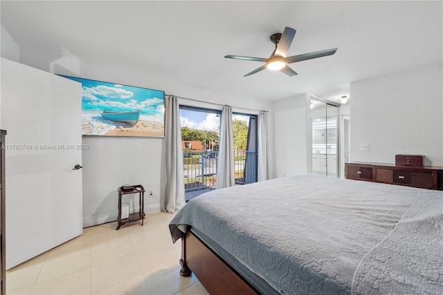 bedroom with baseboards, ceiling fan, light tile patterned floors, ensuite bathroom, and access to outside