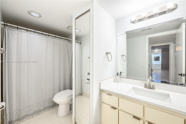 bathroom featuring tile patterned floors, toilet, and vanity