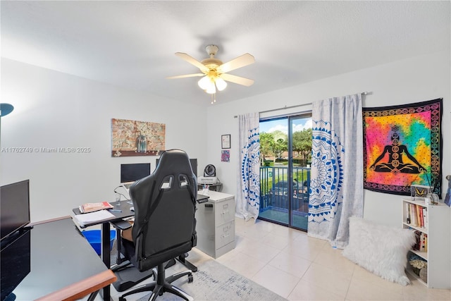 office space with light tile patterned floors and ceiling fan