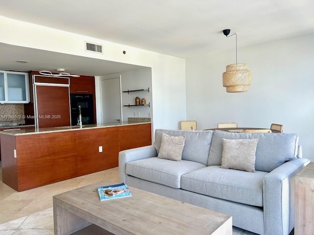 living room featuring visible vents