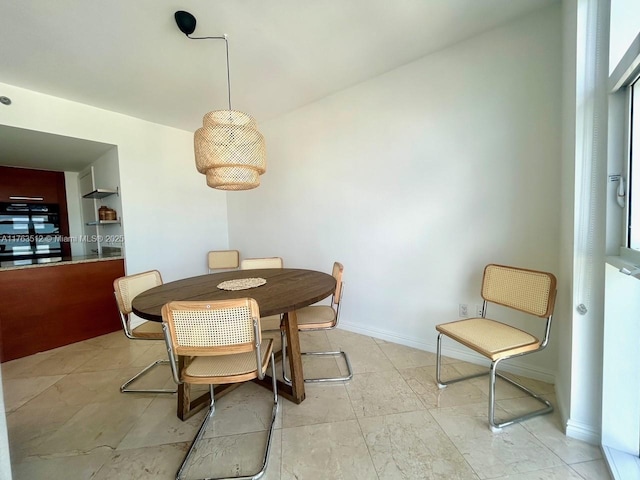 dining room featuring baseboards