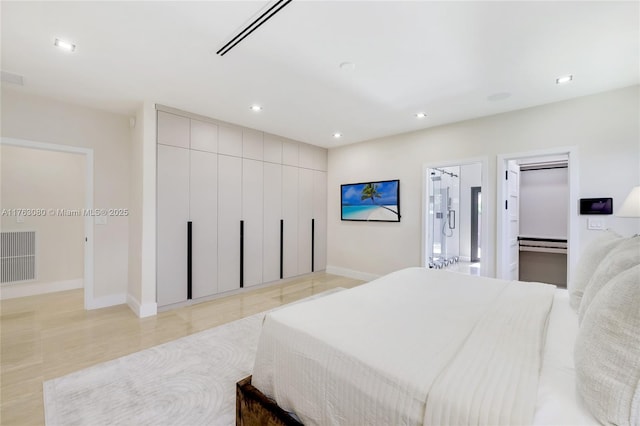 bedroom with a closet, visible vents, recessed lighting, and baseboards