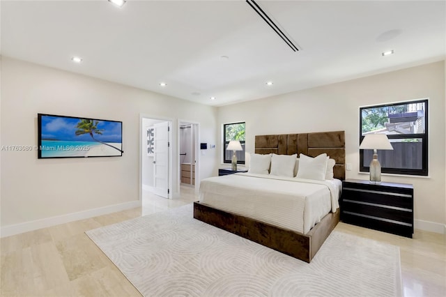 bedroom featuring recessed lighting and baseboards