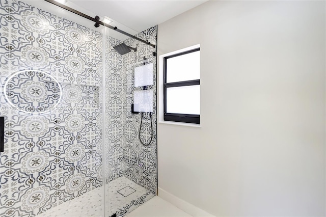 bathroom with tiled shower