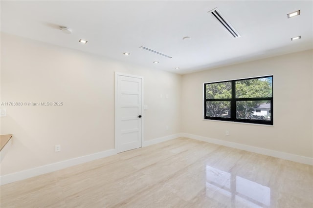 spare room featuring recessed lighting, baseboards, and visible vents