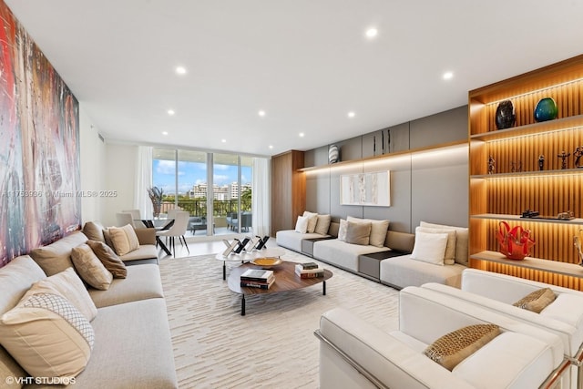 living area featuring recessed lighting and expansive windows