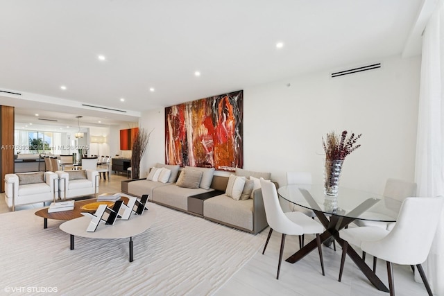 living area with recessed lighting and visible vents