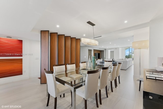 dining space featuring recessed lighting