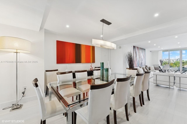 dining space featuring recessed lighting