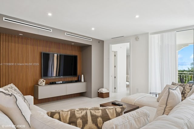 living room featuring visible vents and recessed lighting