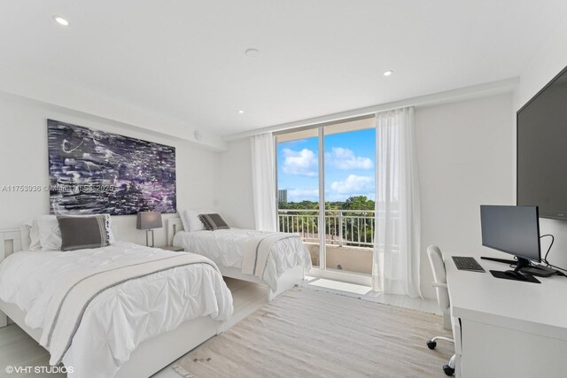 bedroom with recessed lighting, floor to ceiling windows, and access to outside