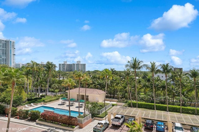 community pool featuring a city view and a patio