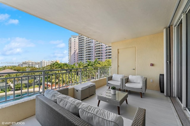 balcony with a view of city and outdoor lounge area