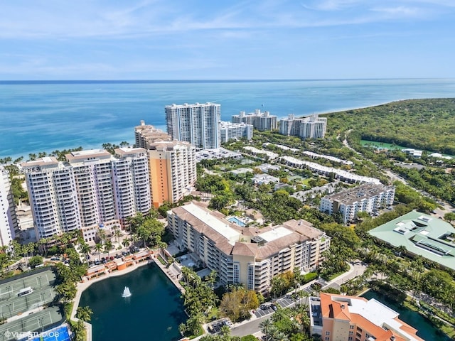 birds eye view of property with a view of city and a water view