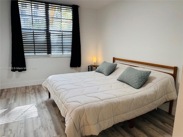19555 E Country Club Dr Unit 8108, Aventura, FL 33180 - bedroom featuring baseboards and wood finished floors