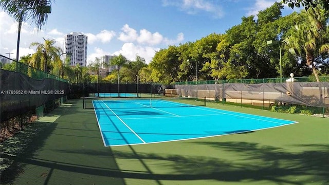 19555 E Country Club Dr Unit 8108, Aventura, FL 33180 - view of tennis court with fence and a city view