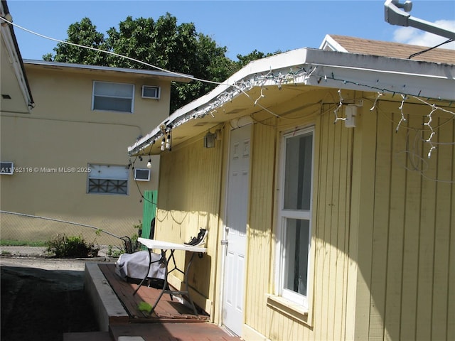 view of property exterior with fence