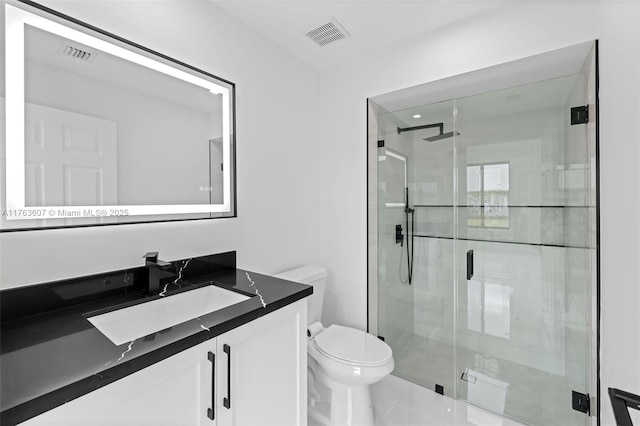 full bathroom featuring visible vents, a shower stall, and toilet