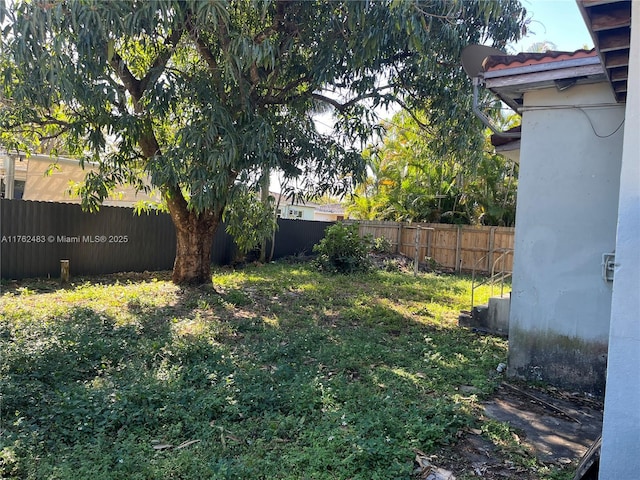 view of yard with a fenced backyard