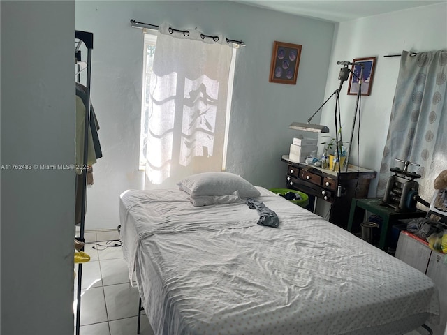 bedroom featuring light tile patterned floors