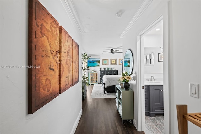 2395 SE 6th St, Pompano Beach, FL 33062 - hall with dark wood-style floors, a sink, and crown molding