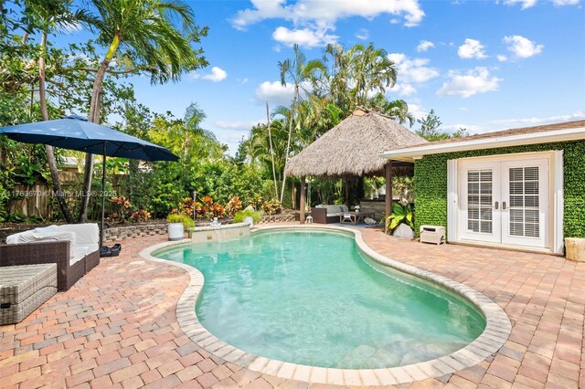 2395 SE 6th St, Pompano Beach, FL 33062 - view of pool with a fenced in pool, a patio, an outdoor living space, french doors, and fence