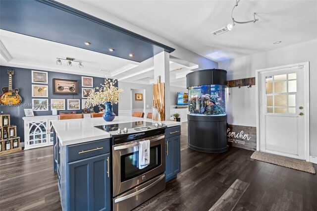 2395 SE 6th St, Pompano Beach, FL 33062 - kitchen featuring rail lighting, blue cabinetry, visible vents, light countertops, and electric stove