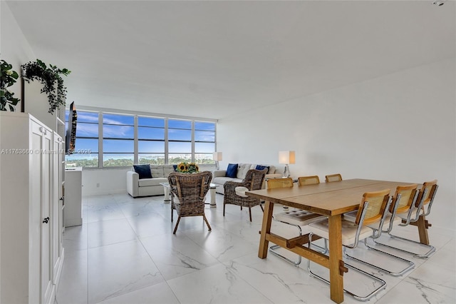 dining room with marble finish floor